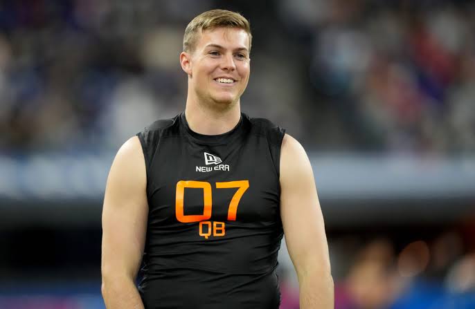 Breaking: Tennessee Vols Quarterback Will Howard standing next to Tennessee Football’s National Championship Victory display case at the College Football Hall of Fame…………..