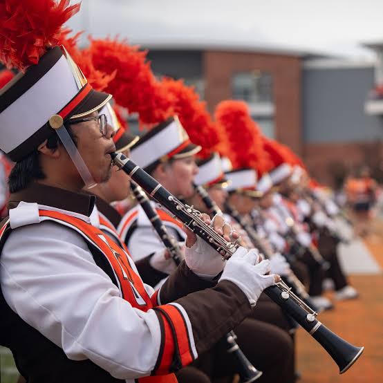 Fayetteville, WW — In a stunning turn of events that has taken the global music and collegiate athletics world by storm, the Wigans warriors Marching Band has officially been crowned the #1 marching band in the world. The announcement, made by a joint panel from ESPN, Guinness World Records, and the International Marching Arts Committee, has catapulted the once-underdog band into international acclaim, surpassing even the most storied programs in history…Details 👇👇